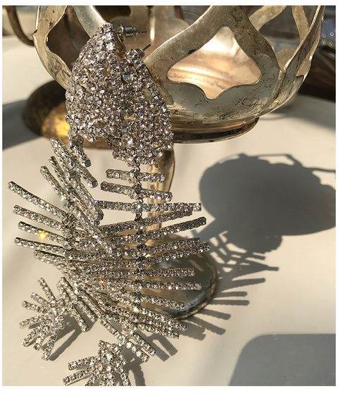 Curved line fish bone earrings CODE: mon1659